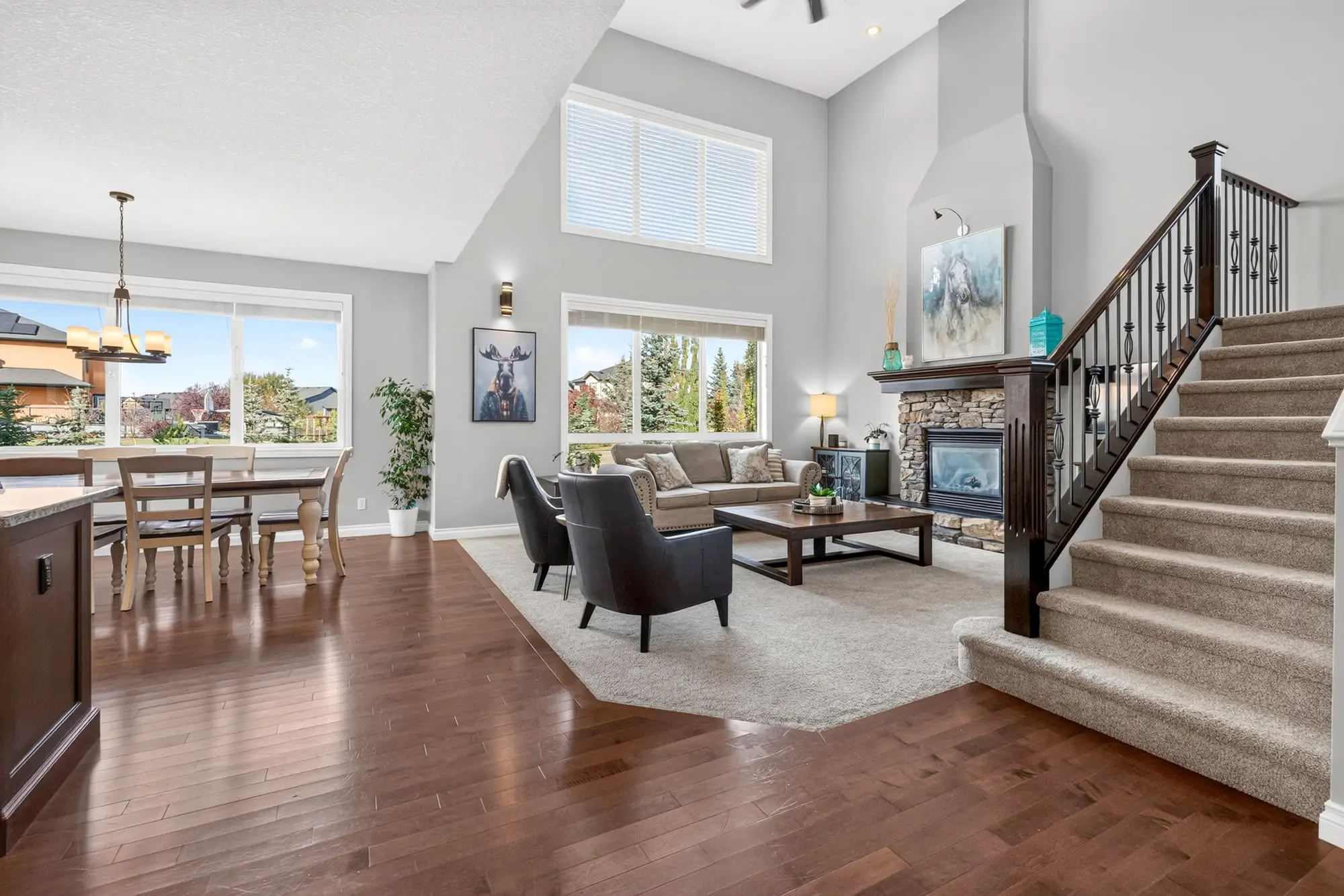 Great room with vaulted ceiling and stone fireplace