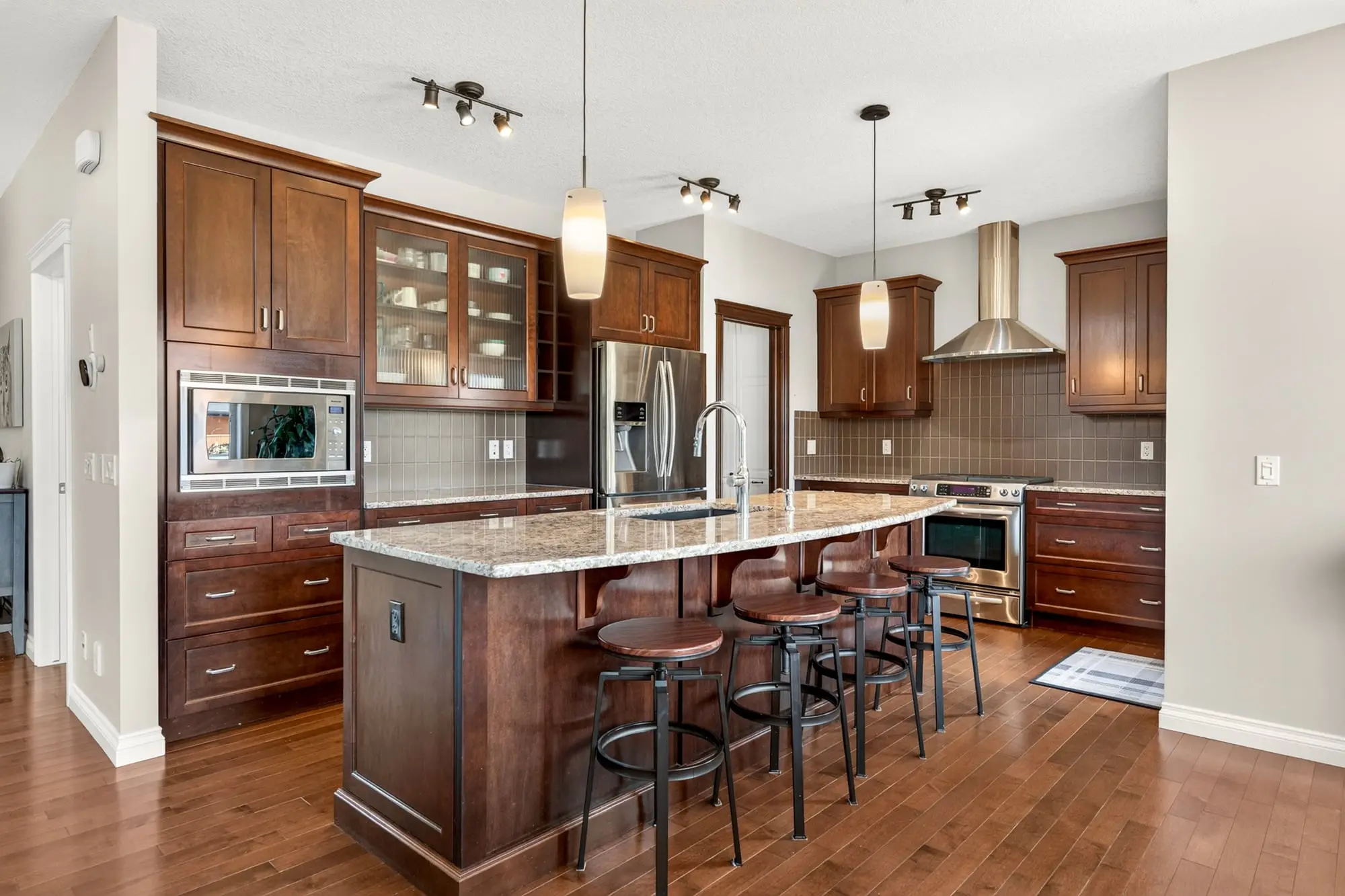 Kitchen island with granite counters and seating