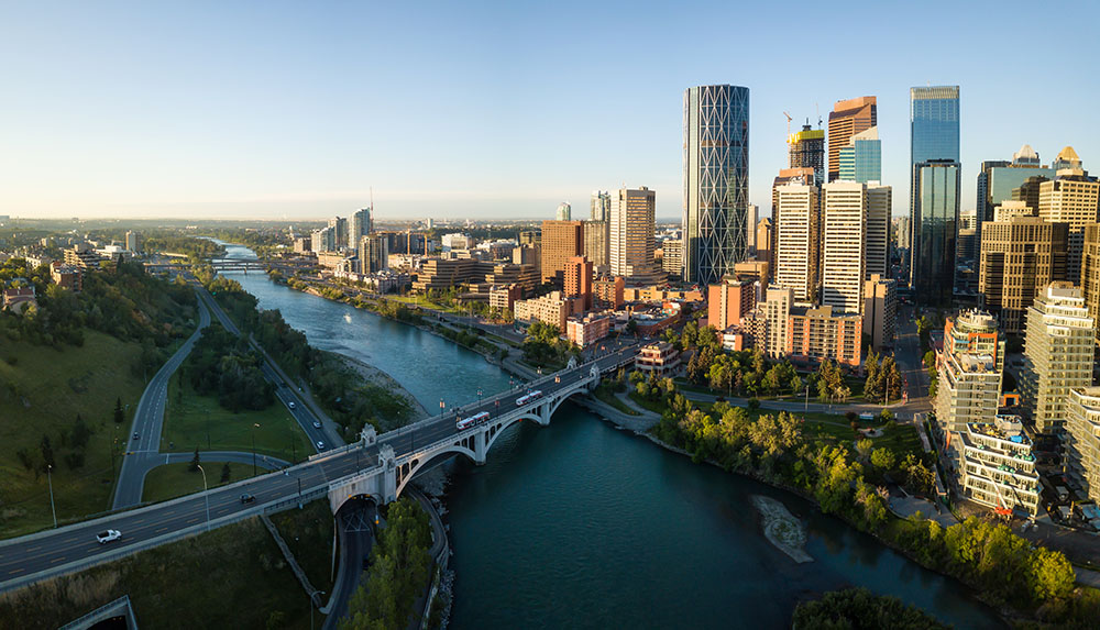 Aerial view of downtown Calgary and the Bow River at golden hour
